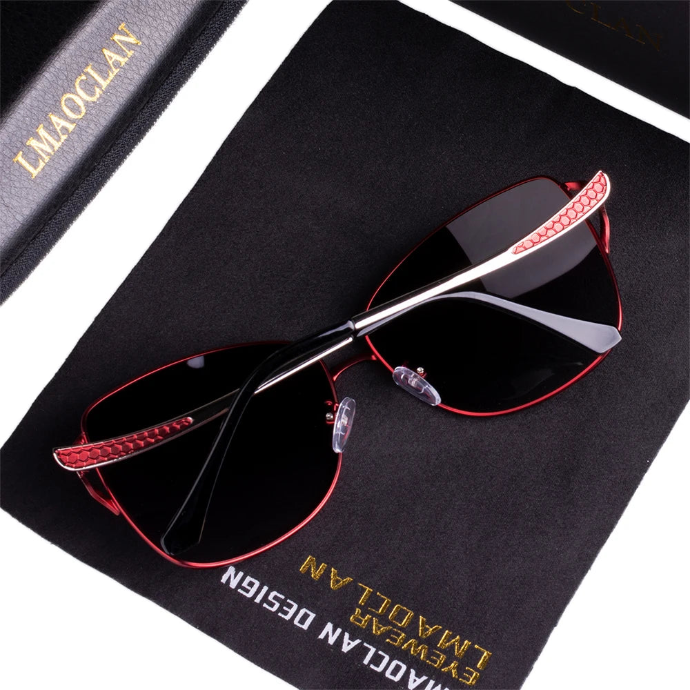 a pair of sunglasses sitting on top of a book