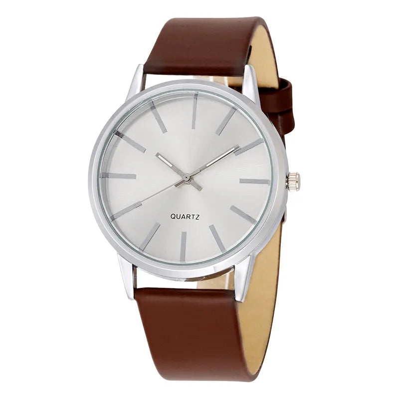 a white and brown watch with a brown strap